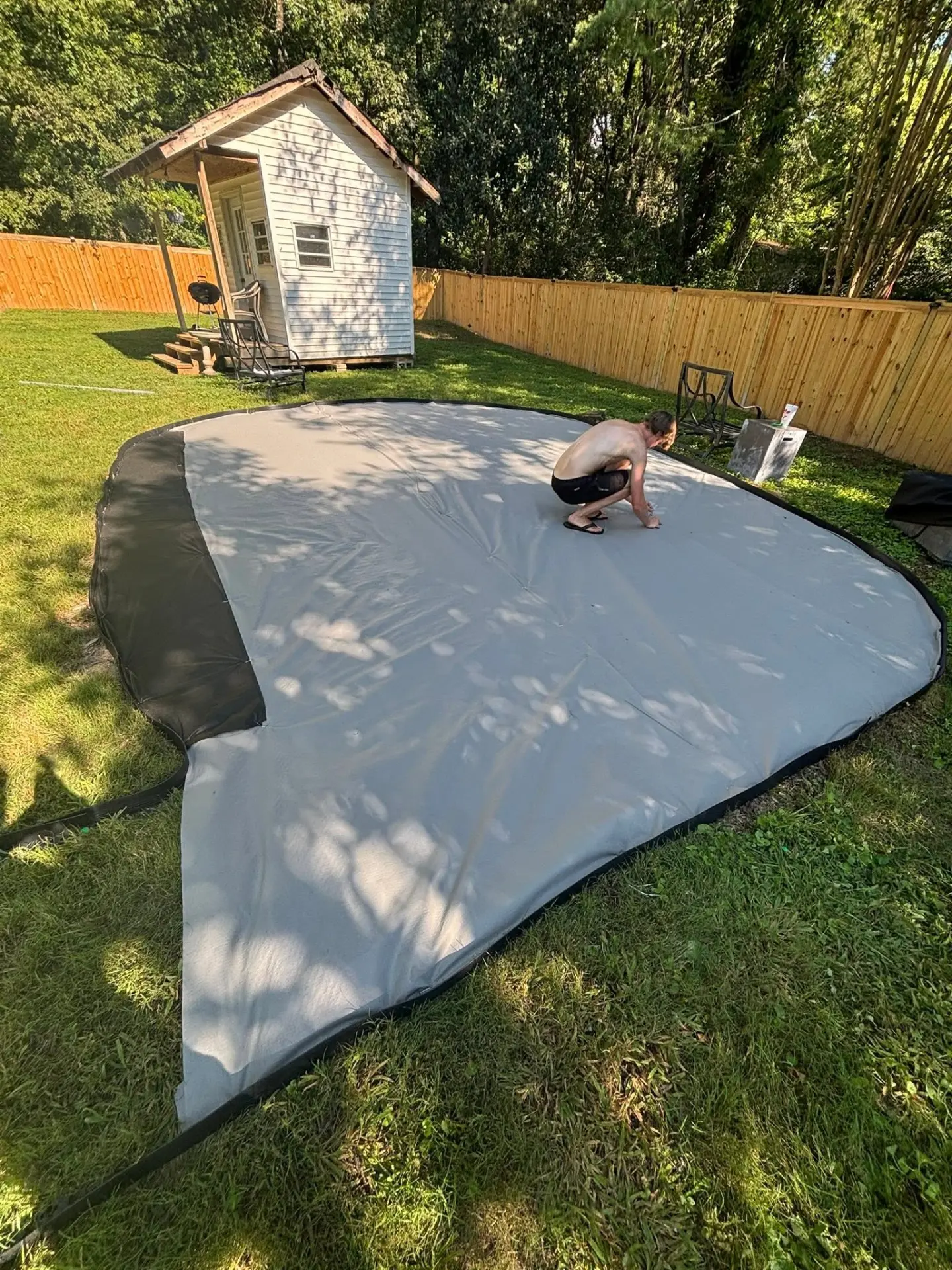 Landscape fabric laid out for a new backyard hardscape patio