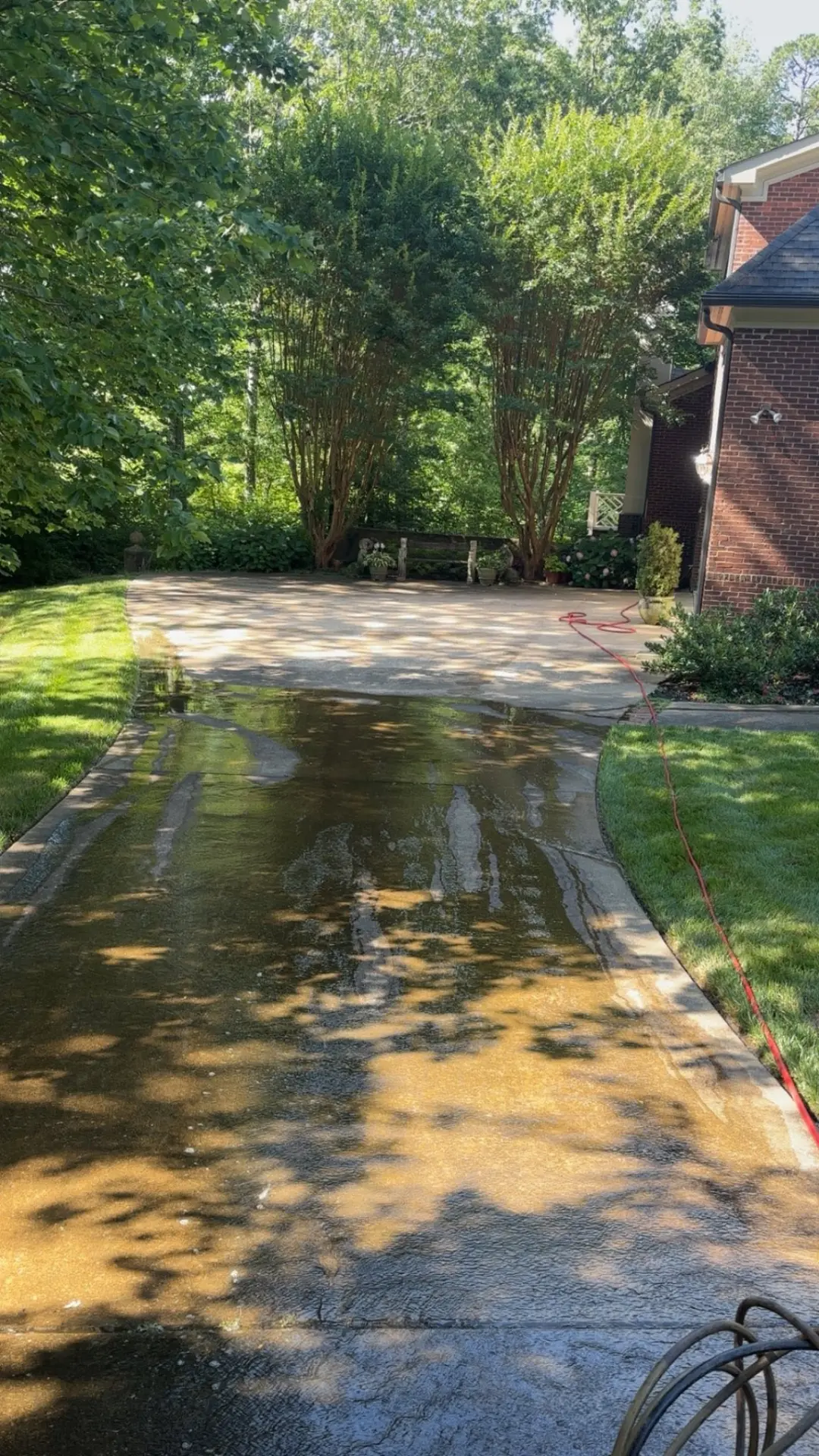 Concrete driveway being pressure washed clean in Chattanooga, TN